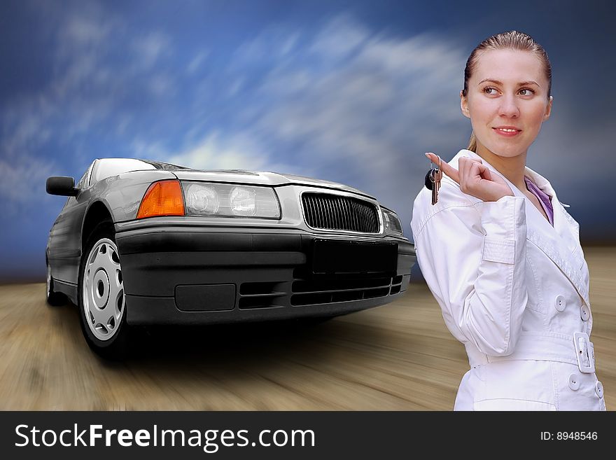 Beautiful women with keys of car on the grunge background