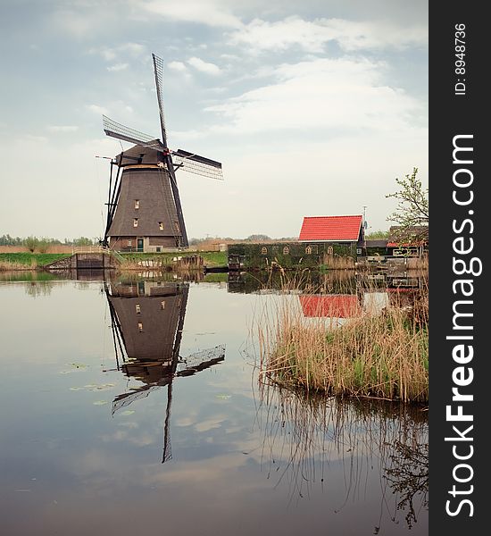 Taken in kinderdijk, Rotterdam, Holland. A windmill and reflection on water.