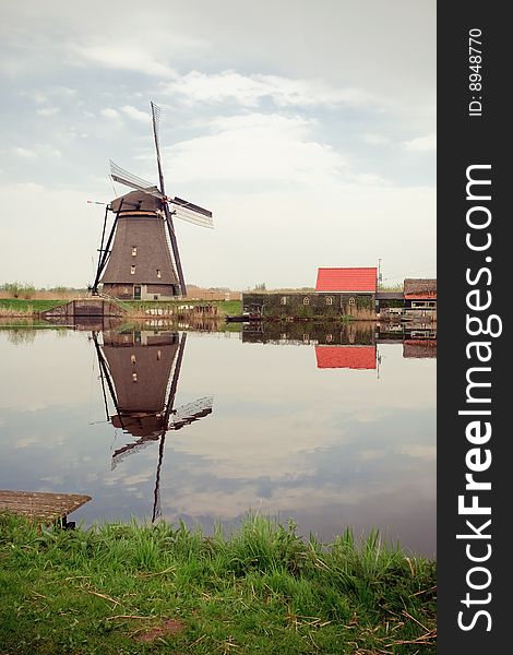 Taken in kinderdijk, Rotterdam, Holland. A windmill and reflection on water.