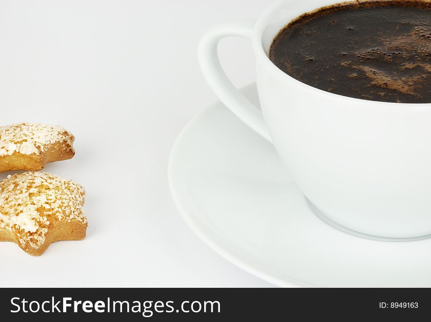 Coffee cup and a couple of biscuits