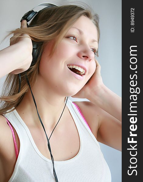 Woman listening music and dances