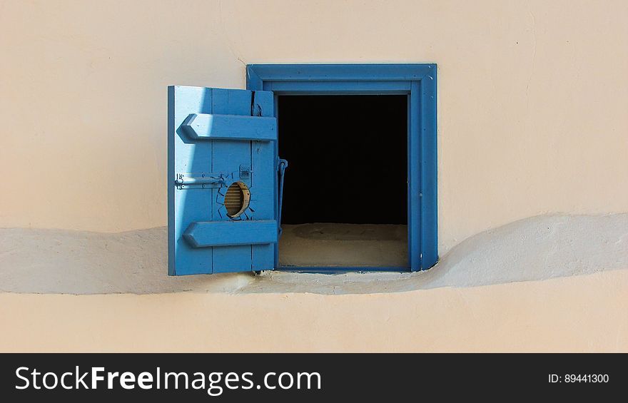 Blue Door On Exterior Wall