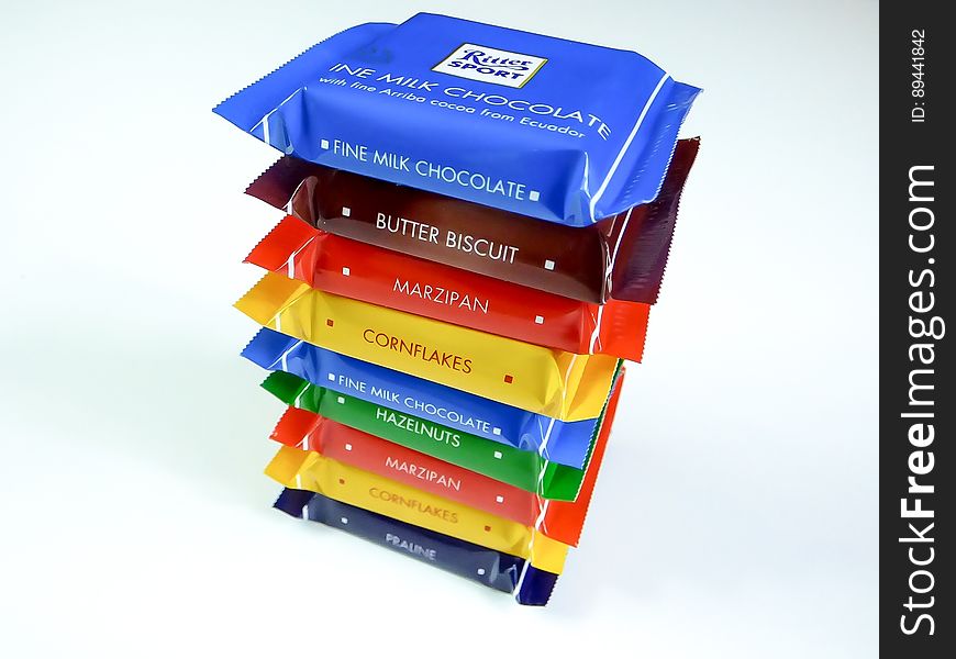 A stack of miniature chocolates with different flavors.