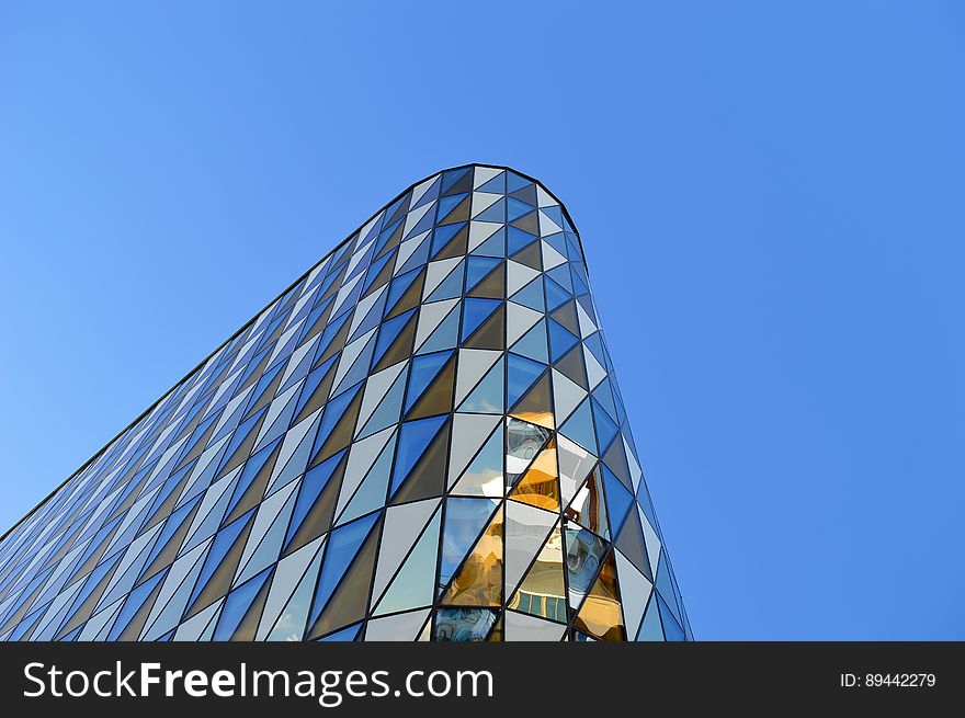 A modern skyscraper with curved facade.