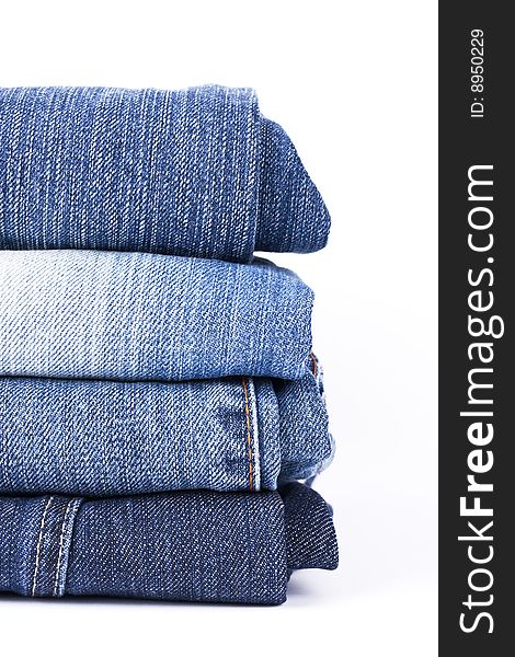 Stack of Blue Jeans isolated over white