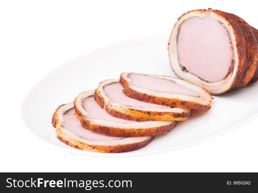 Delicious baked ham with bacon isolated over white. Bon appetit!. Delicious baked ham with bacon isolated over white. Bon appetit!
