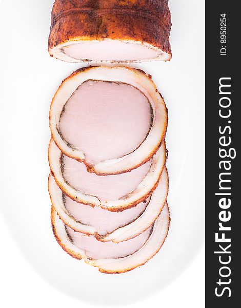 Delicious baked ham with bacon isolated over white. Bon appetit!. Delicious baked ham with bacon isolated over white. Bon appetit!