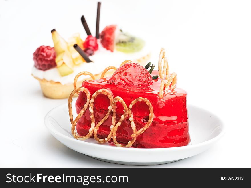 Cake with strawberry topping on a plate. Cake with strawberry topping on a plate