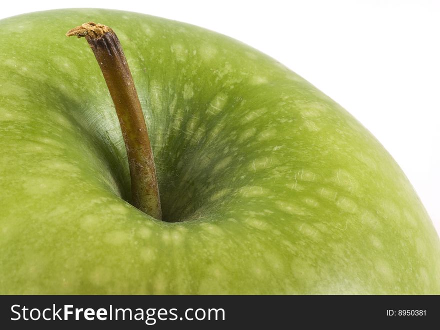 Part of a delicious green apple isolated on white. Part of a delicious green apple isolated on white.