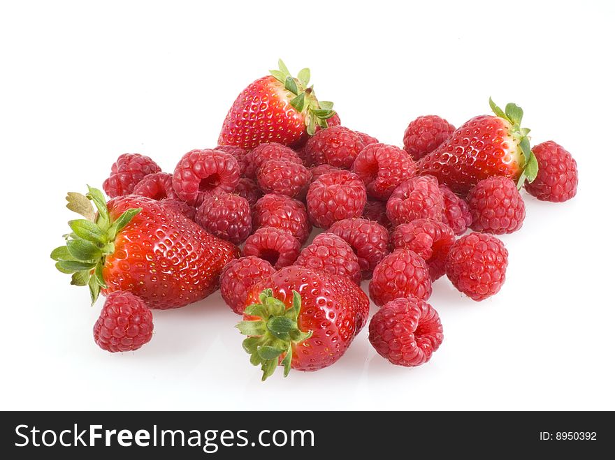 Bunch of strawberries and raspberries isolated on white. Bunch of strawberries and raspberries isolated on white.