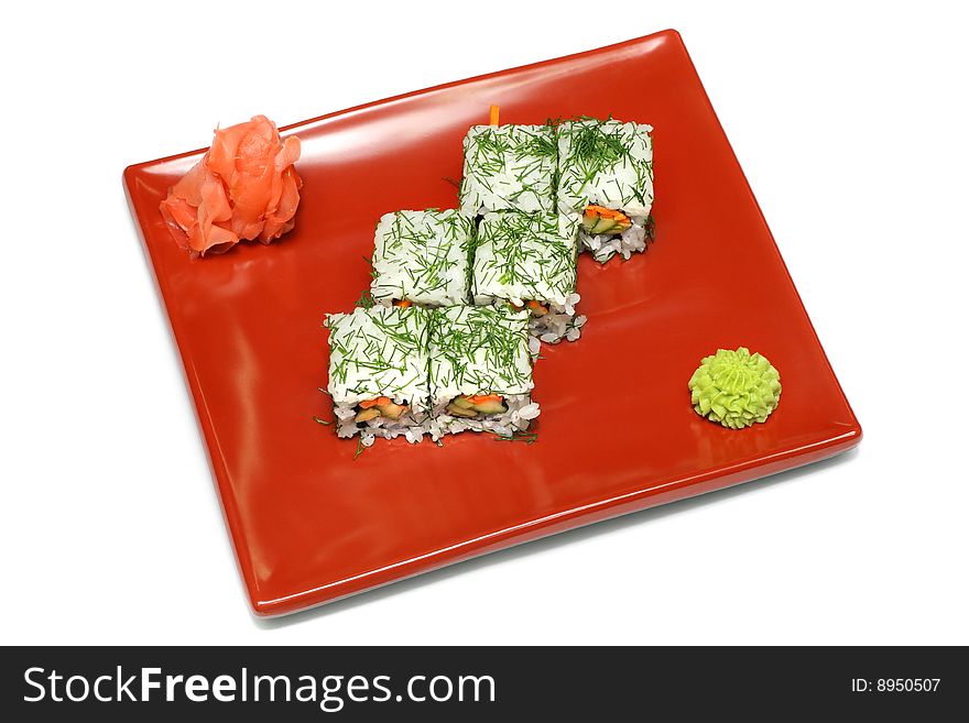 A square plate with six Japanese rolls, ginger and wasabi paste. A square plate with six Japanese rolls, ginger and wasabi paste