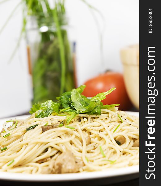 Fresh pasta with salad on it