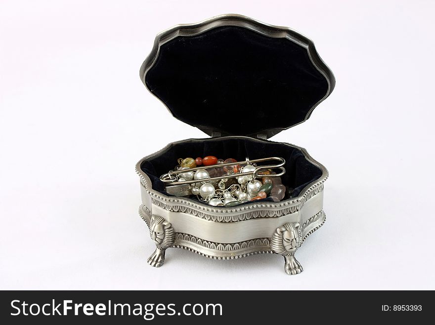 A tin jewelry box on the white background.