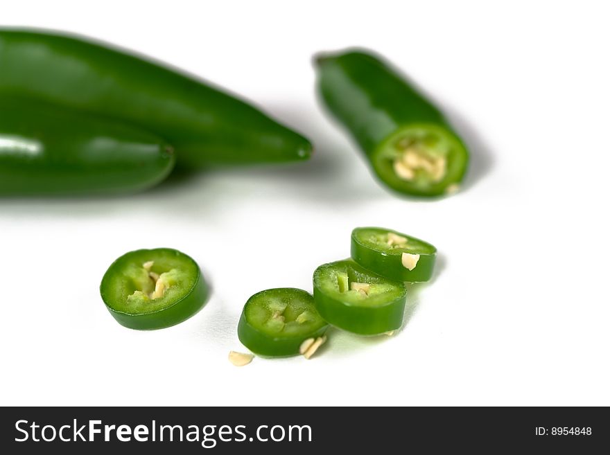 Hot Serrano chili on a white background. Hot Serrano chili on a white background.