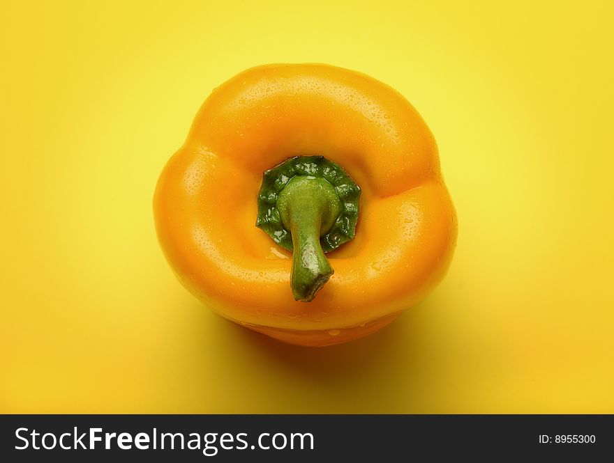 Yellow pepper on a yellow background