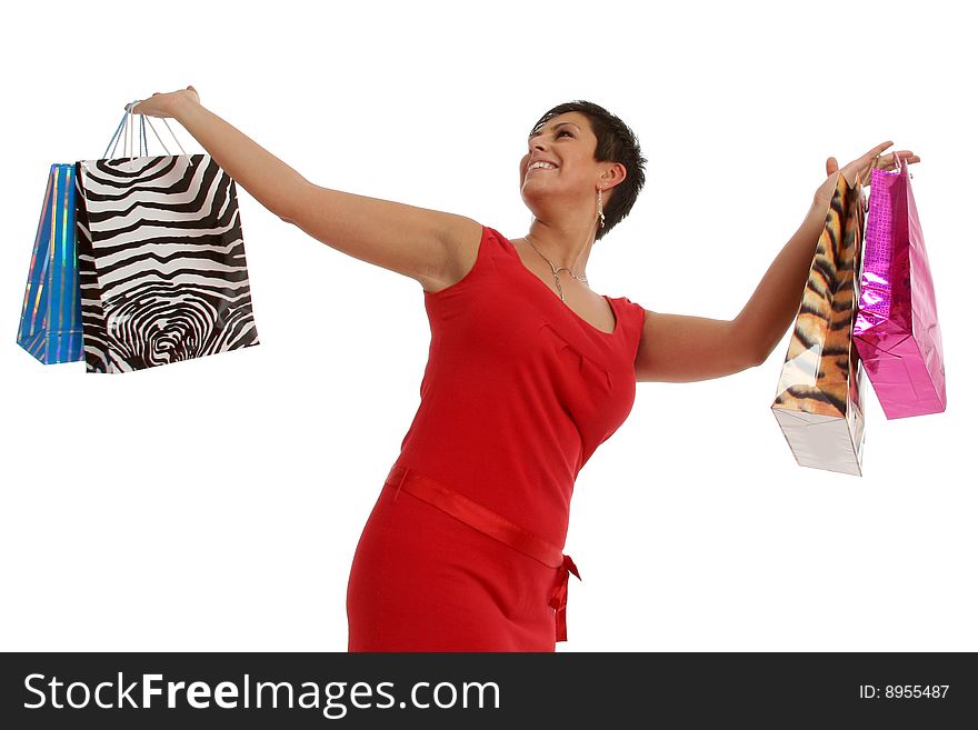 Half body view of young attractive woman doing shopping with lots of shopping bags. Isolated on white background. Half body view of young attractive woman doing shopping with lots of shopping bags. Isolated on white background.