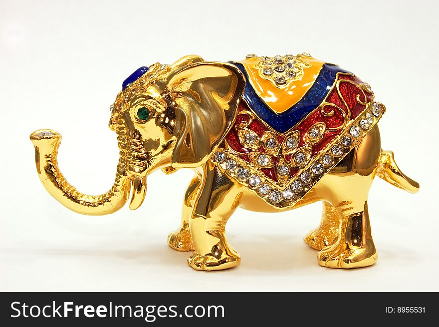 Golden coloured small elephant nice figurine. Golden coloured small elephant nice figurine