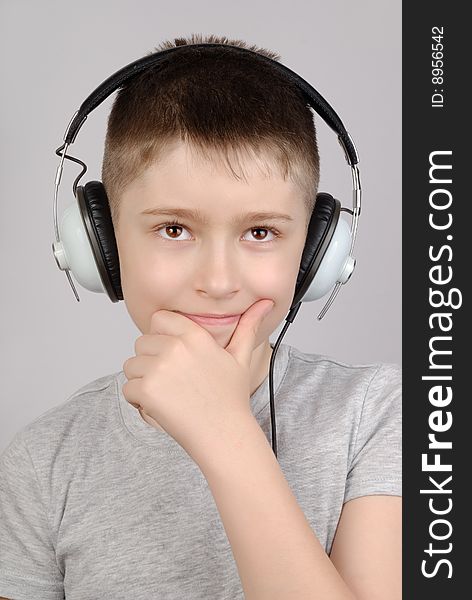 Portrait of listening boy in headphones