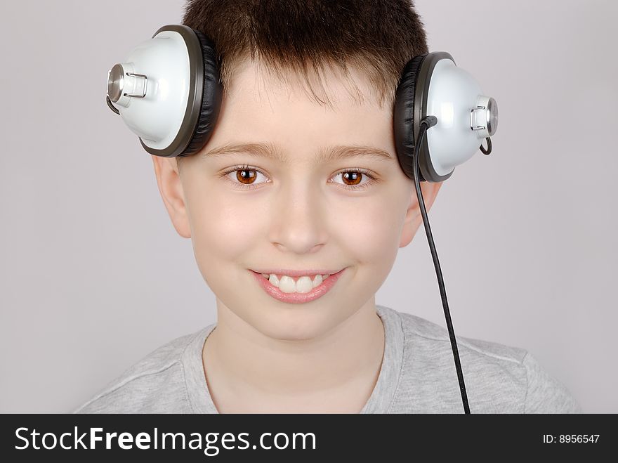 Portrait of listening boy in headphones. Portrait of listening boy in headphones