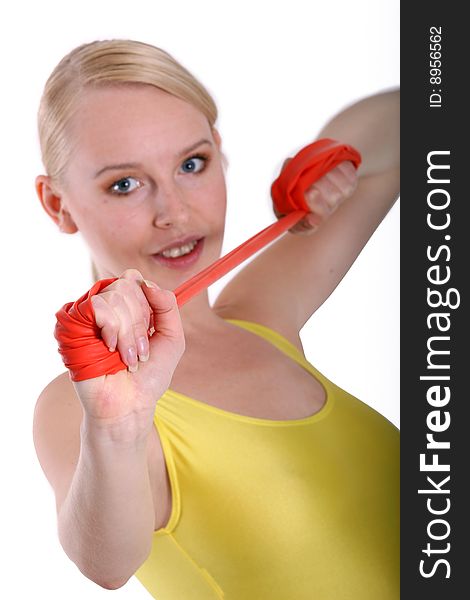 Woman doing sport exercises with elastic band
