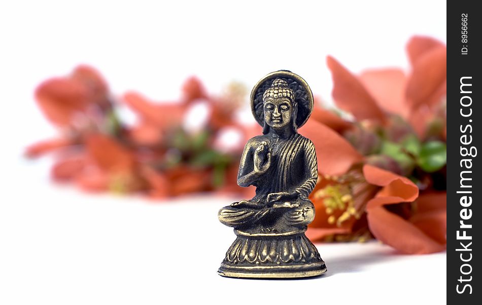 Isolated Buddha With Red Flowers