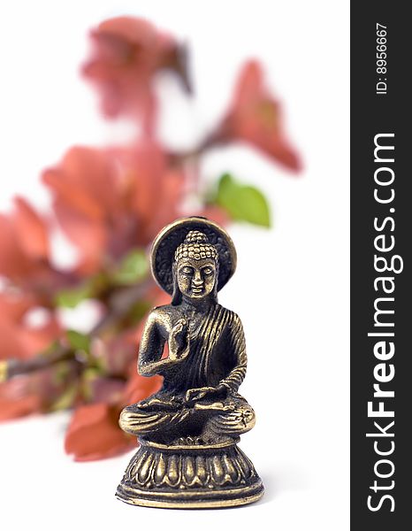 Isolated Buddah With Red Flowers