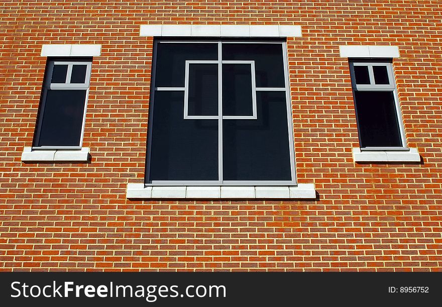 Three window and simple brick wall architecture. Three window and simple brick wall architecture