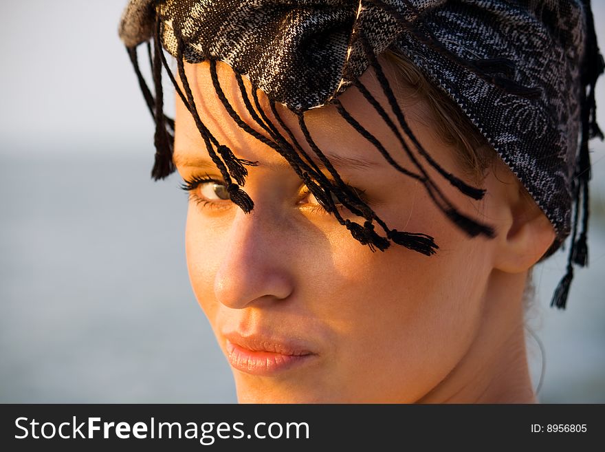 A young girl in the headdress. A young girl in the headdress