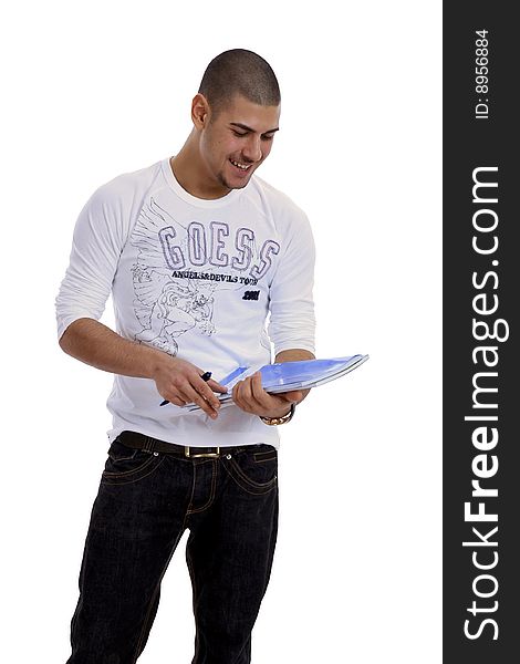 Half body view of college student in casual wear, holding exercise books. Isolated on white background.