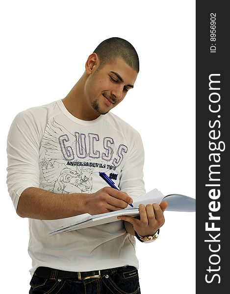 Half body view of college student in casual wear, holding exercise books. Isolated on white background.