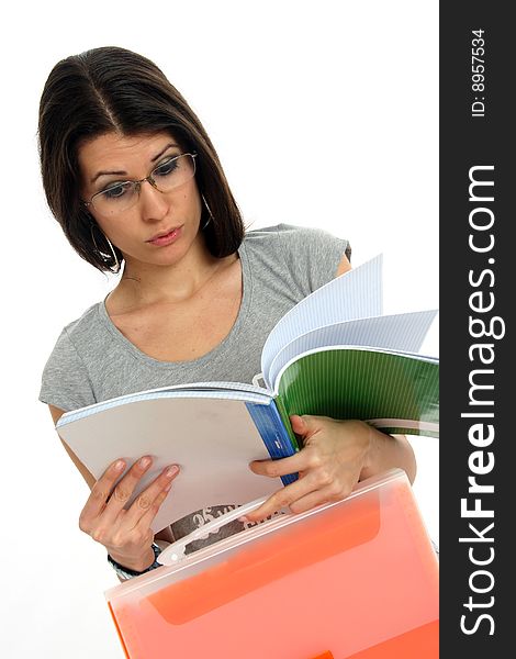 Half body view of college student or young teacher in casual wear, holding exercise books. Isolated on white background.