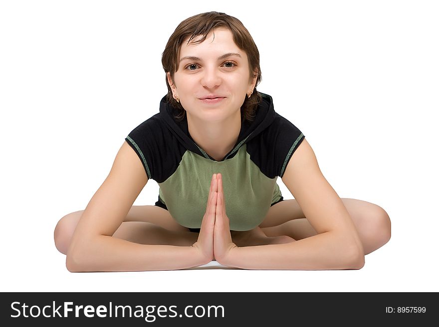 Young slim woman making yoga exercise isolated at the white background. Young slim woman making yoga exercise isolated at the white background