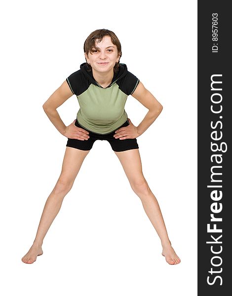 Young slim woman making fitness exercises isolated at the white background. Young slim woman making fitness exercises isolated at the white background