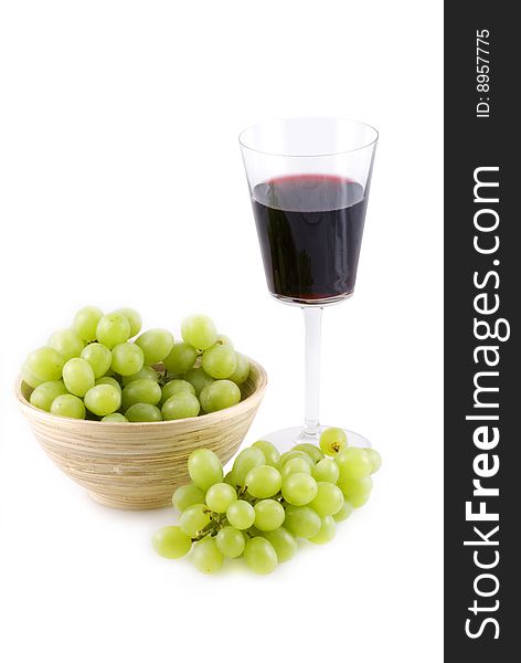 Wine and grapes isolated on white. Wine and grapes isolated on white.