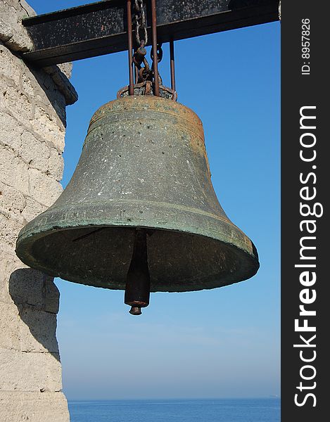 Old bronze bell for alarm signals in dense fog. Sevastopol,Ukraine