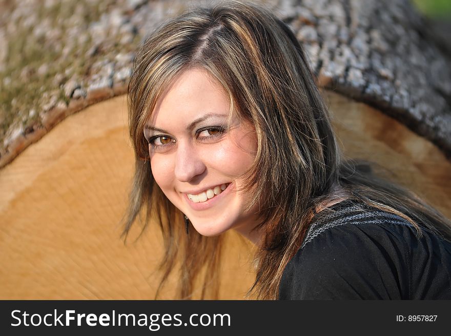 Outdoor portrait of a brunette woman with big brown eyes. Outdoor portrait of a brunette woman with big brown eyes