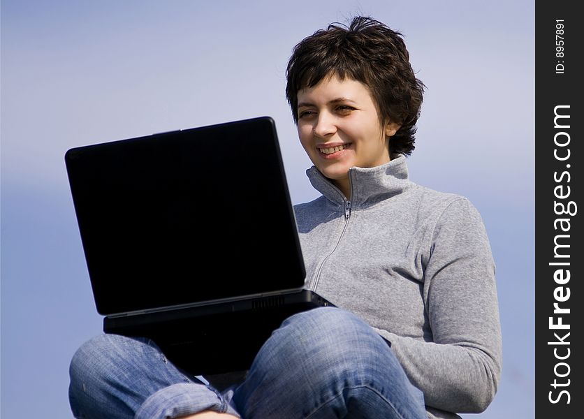 Young Casual Woman Working On Laptop