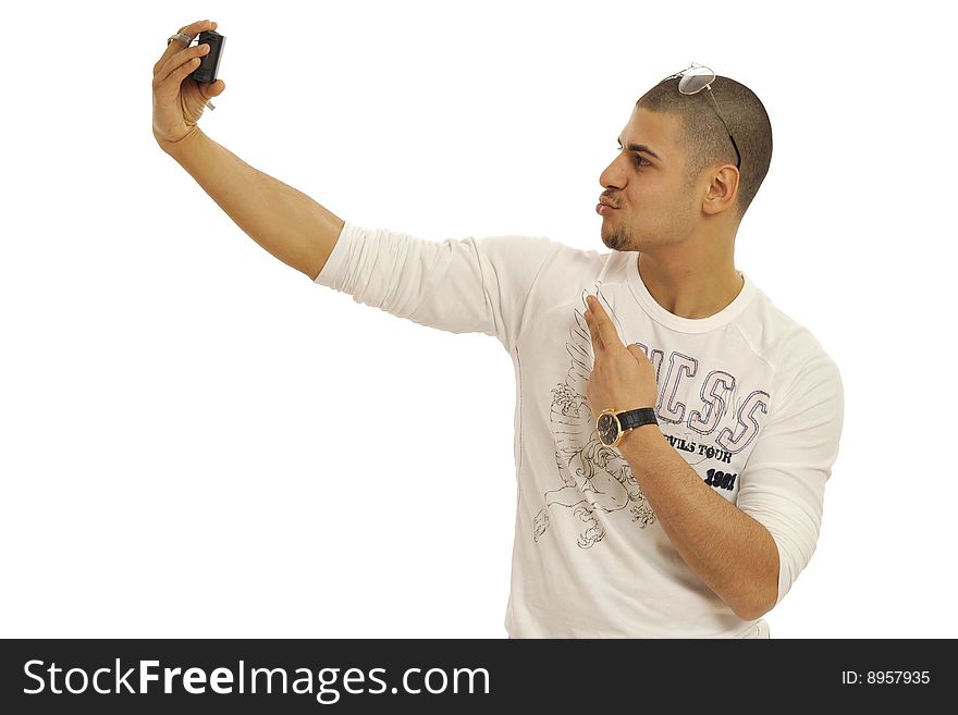 Half body view of attractive young man taking a self-portrait and making funny faces. Isolated on white background. Half body view of attractive young man taking a self-portrait and making funny faces. Isolated on white background.