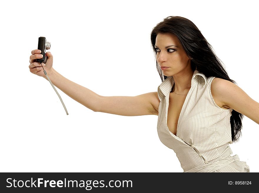 Half body view of attractive brunette shooting with small camera. Isolated on white background. Half body view of attractive brunette shooting with small camera. Isolated on white background.