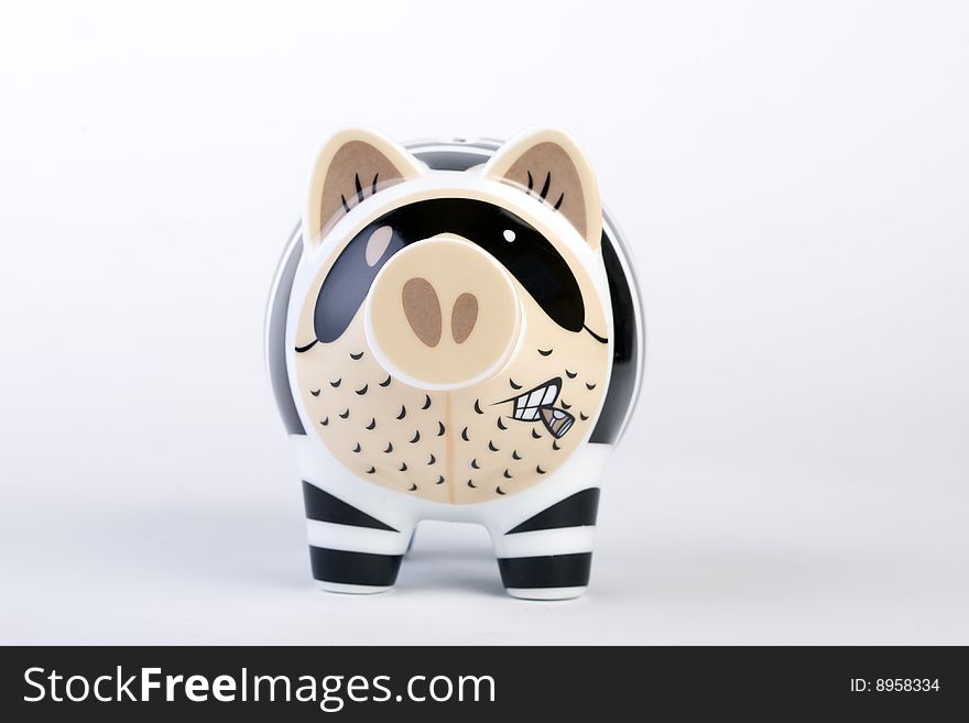 Aggressive piggybank with cigar in mouth