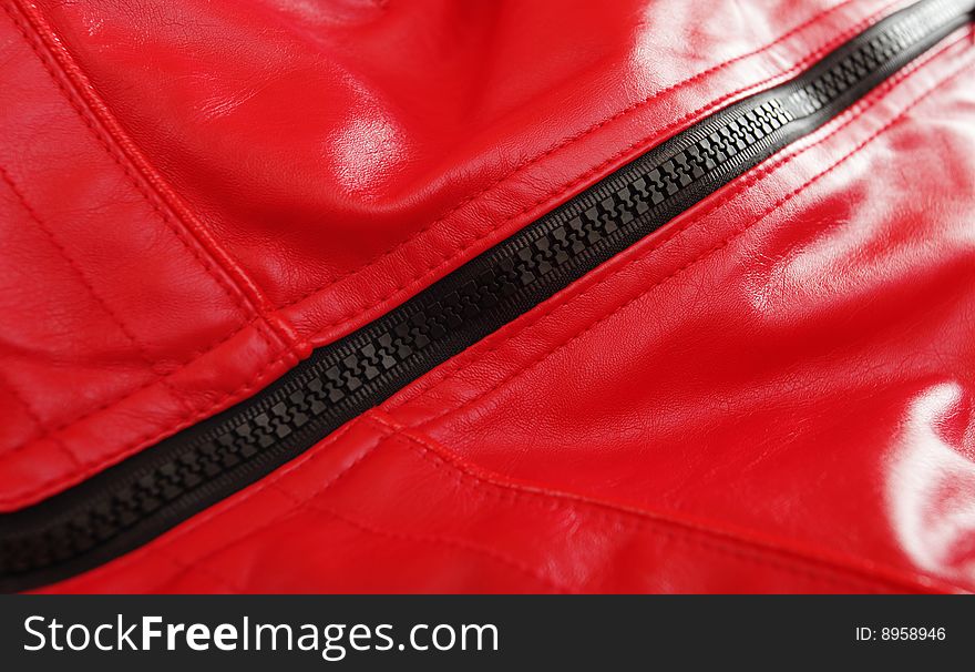 Black fastener on a red leather jacket