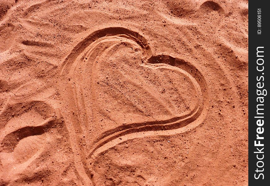 Heart shape in pink sand. Heart shape in pink sand.