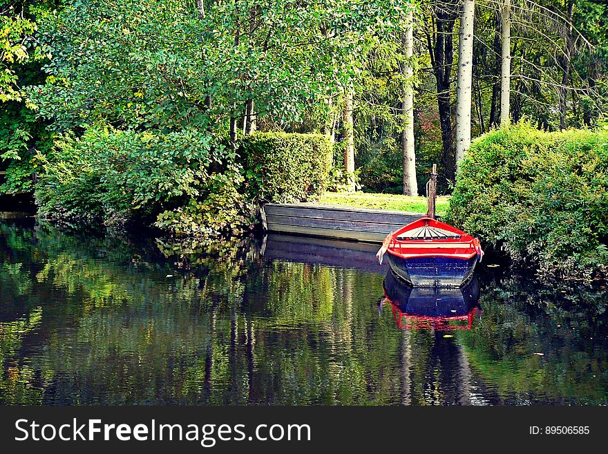 Boat Moored To Banks In Park