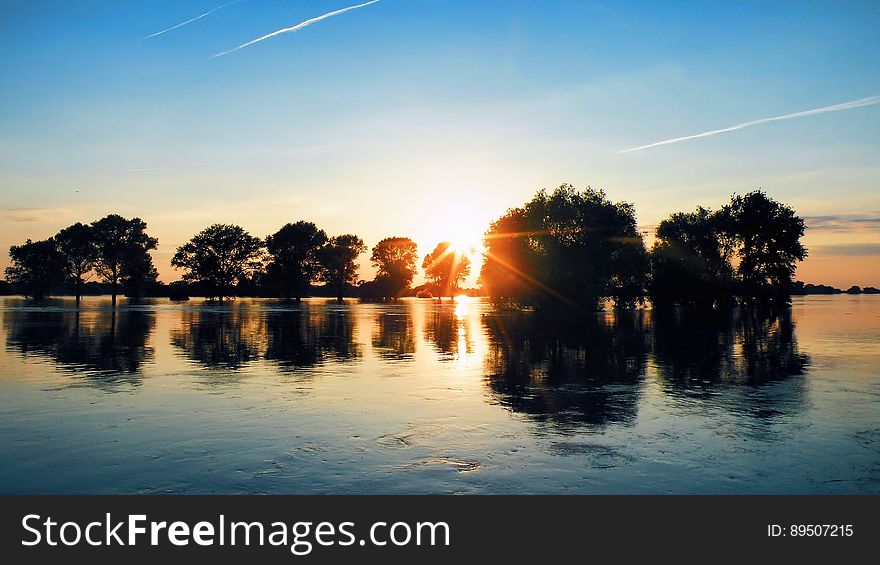 Scenic View of Lake Against Sky during Sunset