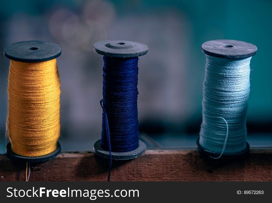 Three spools with colorful strings. Three spools with colorful strings.