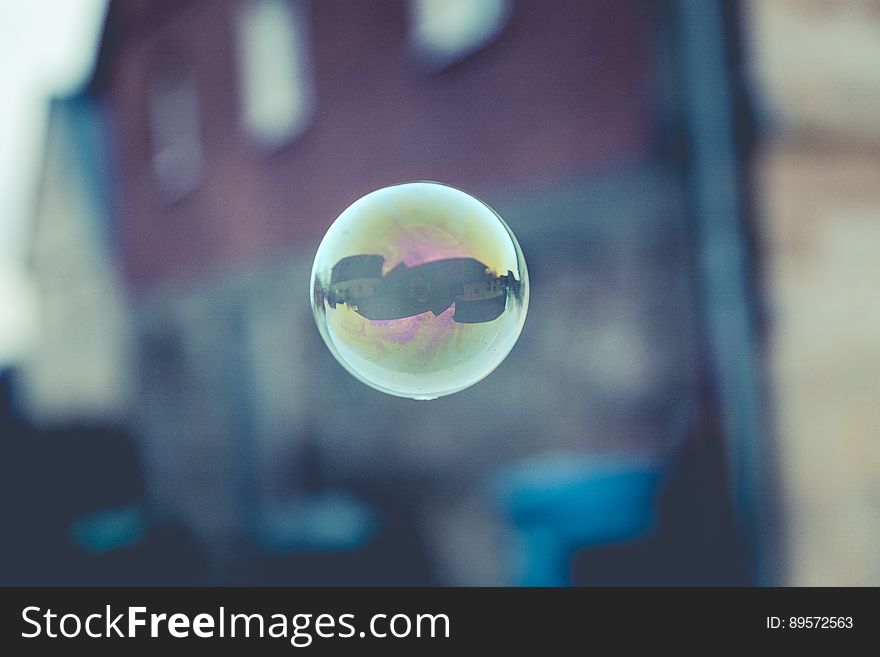 A soap bubble floating in the air.