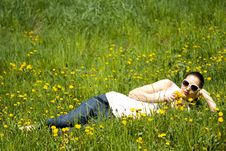 Young Woman In Nature Smelling  Flowers Royalty Free Stock Photos