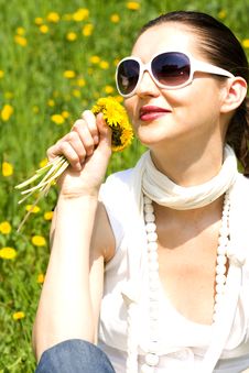 Young Woman In Nature Smelling Flowers Royalty Free Stock Image
