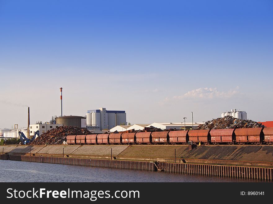 Typical industrial harbor scene in front of a blue sky. Typical industrial harbor scene in front of a blue sky.