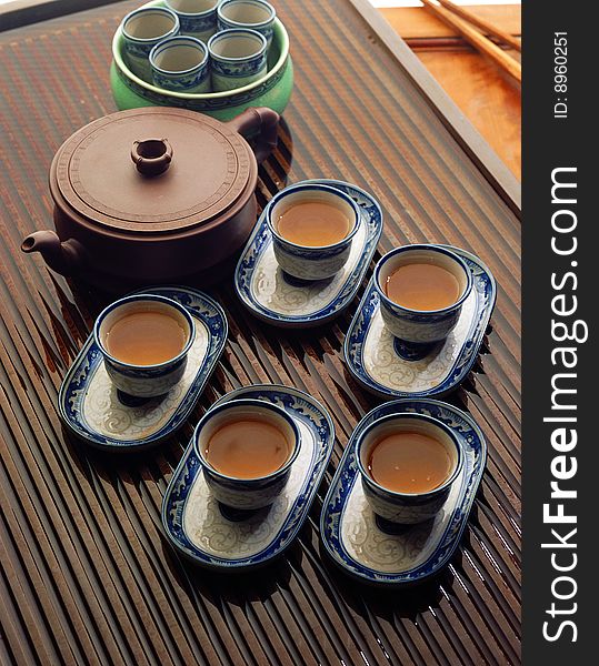 Chinese kung fu tea set
five cups of tea and a ceramic pot